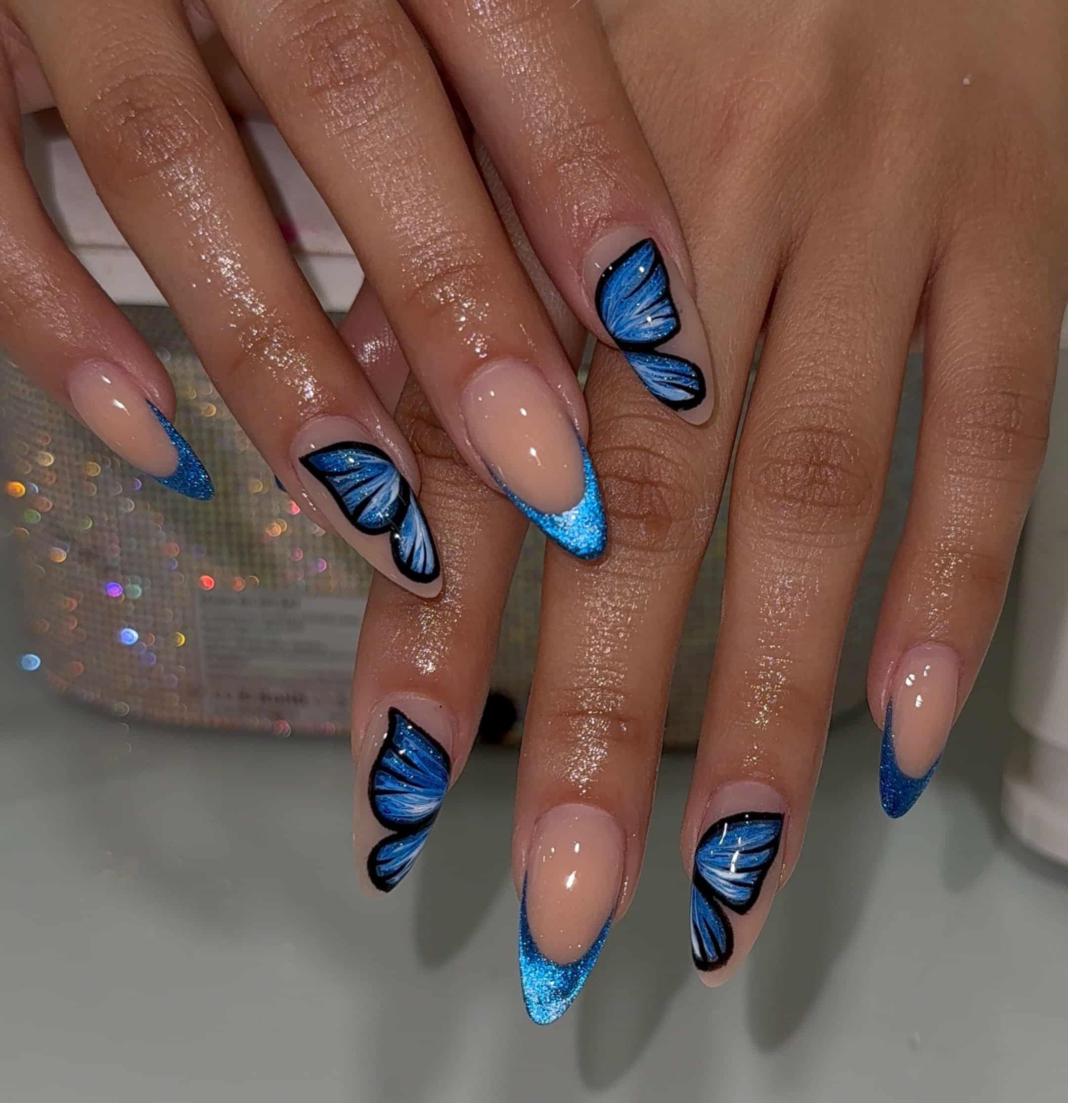 7. Electric Blue Butterfly French Almond Nails - butterfly nail ideas