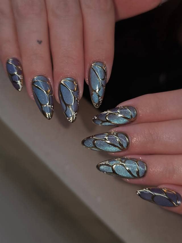 8. Steel Blue Stained-Glass Butterfly Wing Nails - butterfly nail ideas
