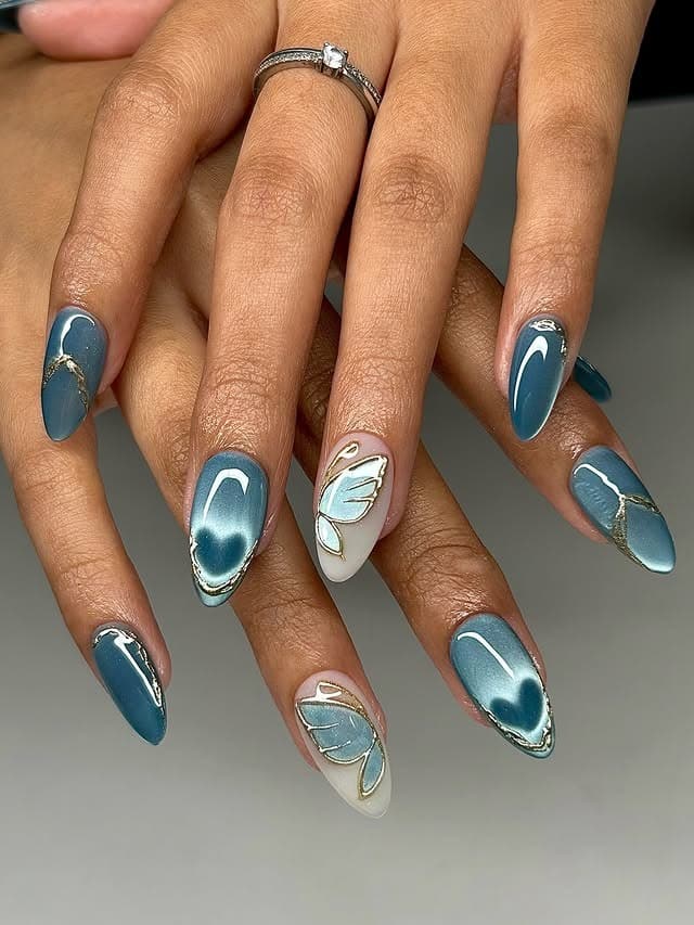 9. Teal Chrome Butterfly Accent Nails - butterfly nail ideas