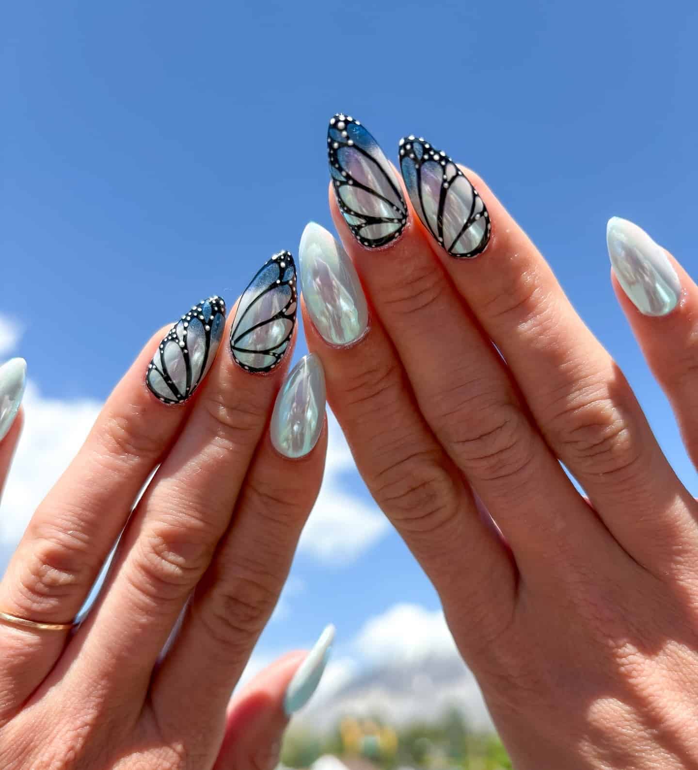 13. Pearl Aqua Monarch Butterfly Nails - butterfly nail ideas