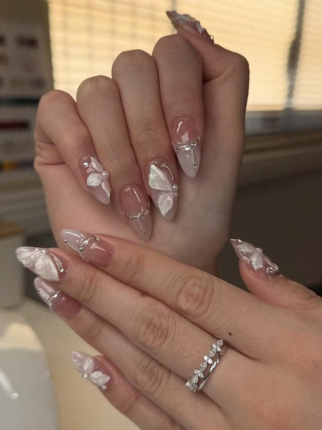 21. Blush Pink 3D White Butterfly Stiletto Nails - butterfly nail ideas