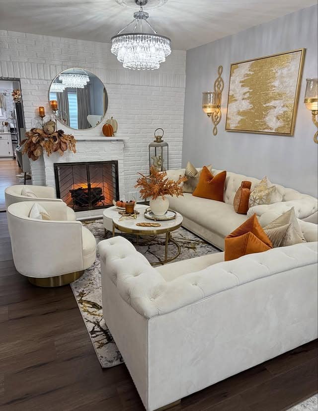 12. Cream, Burnt Orange and Gold Fireplace Living Room - fall living room ideas