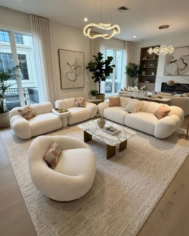 11. Ivory and Blush Curved Modern Living Room - modern living room ideas
