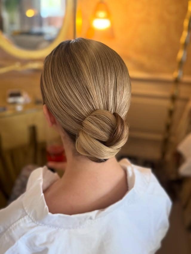 6. Golden Blonde Sleek Low Knot Bun - Sleek Hairstyles