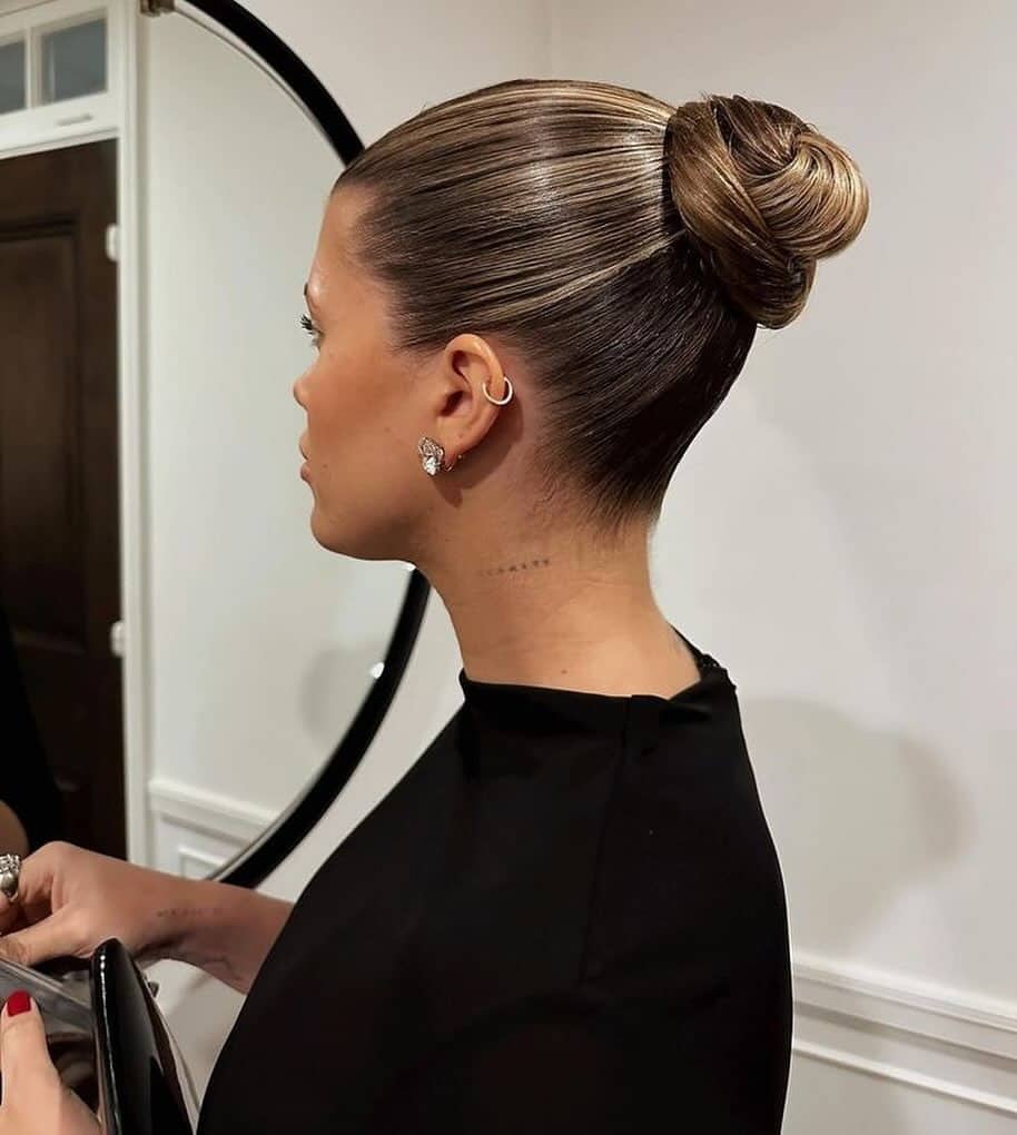 8. Caramel Brunette Sleek Sculpted High Bun - Sleek Hairstyles