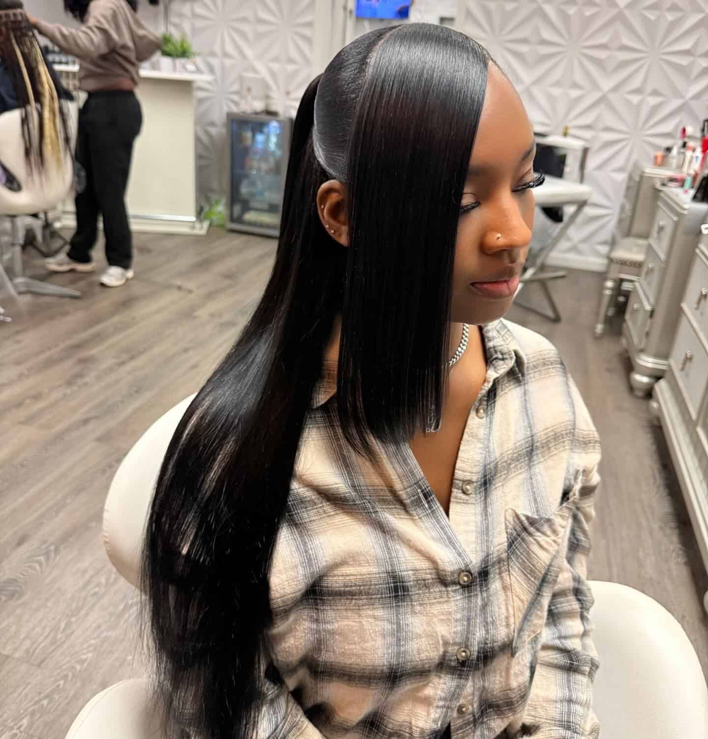 9. Jet Black Sleek Ponytail with Curtain Panels - Sleek Hairstyles