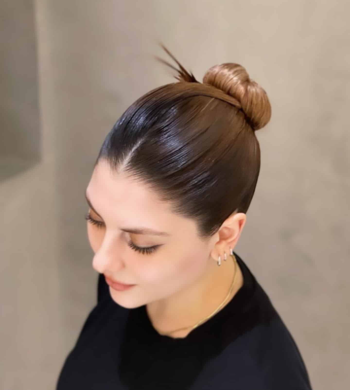 10. Chocolate Brown Sleek Topknot Bun - Sleek Hairstyles
