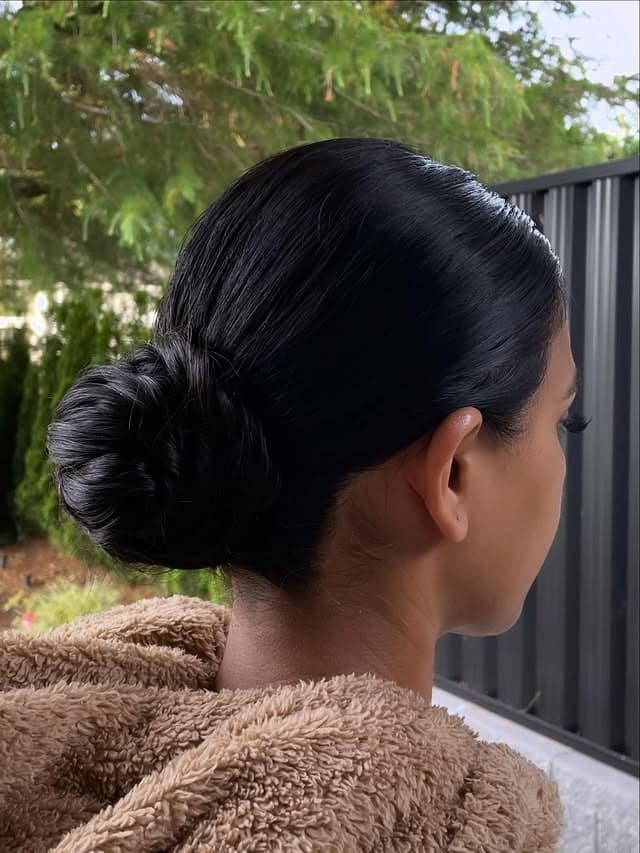 12. Soft Black Sleek Low Bun - Sleek Hairstyles