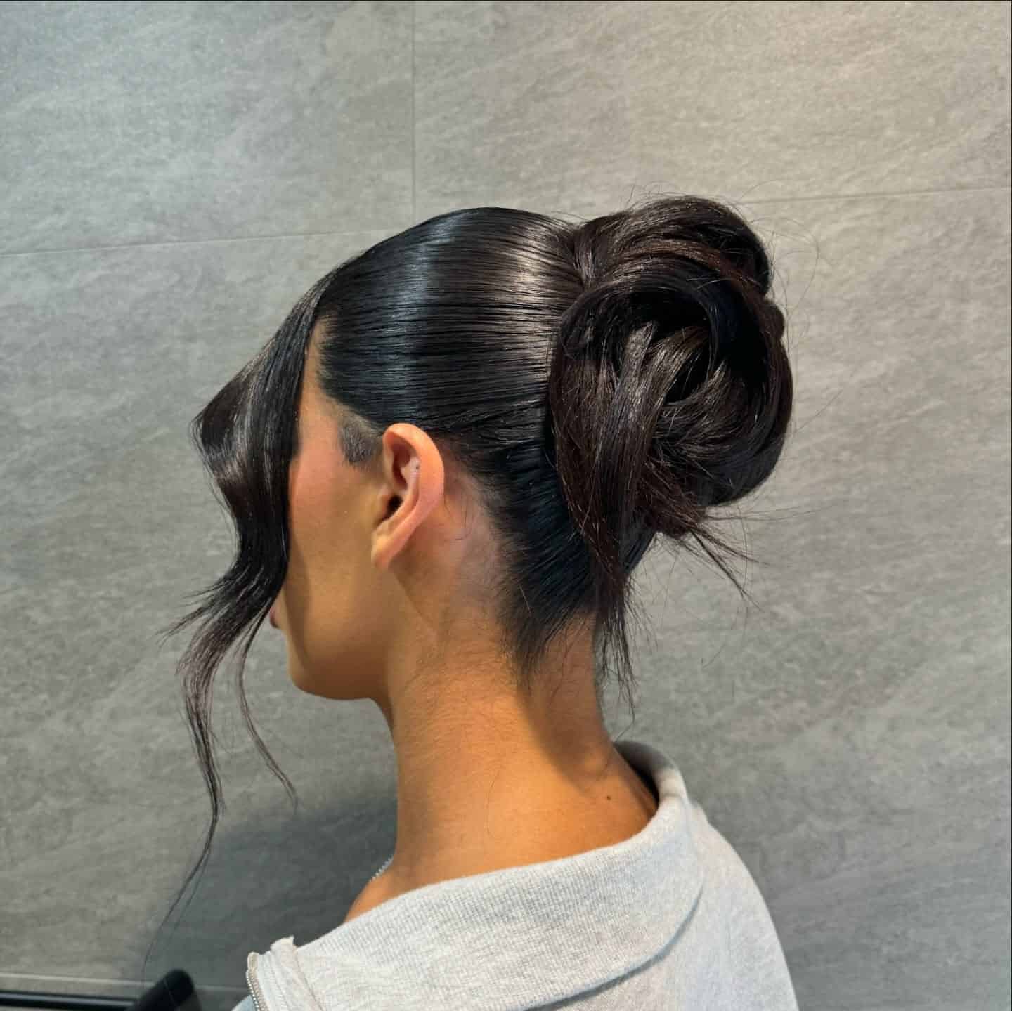 16. Espresso Brown Sleek High Rosette Bun - Sleek Hairstyles