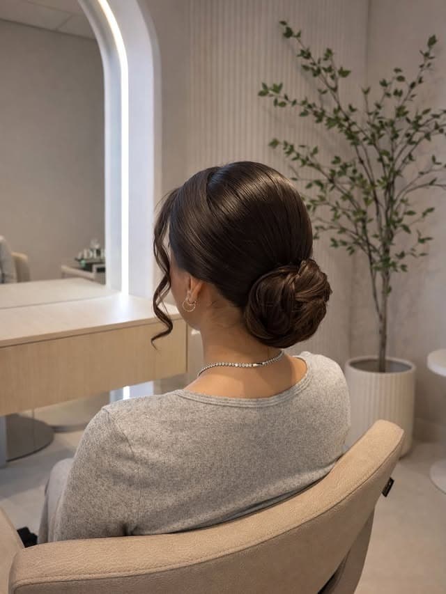 18. Deep Brunette Sleek Textured Low Bun - Sleek Hairstyles