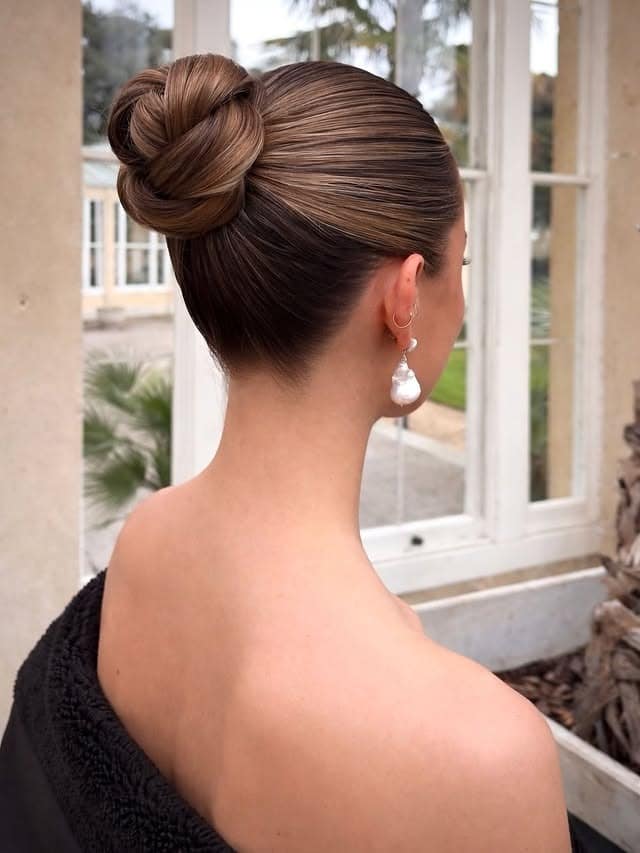 21. Chestnut Brunette Sleek Braided High Bun - Sleek Hairstyles