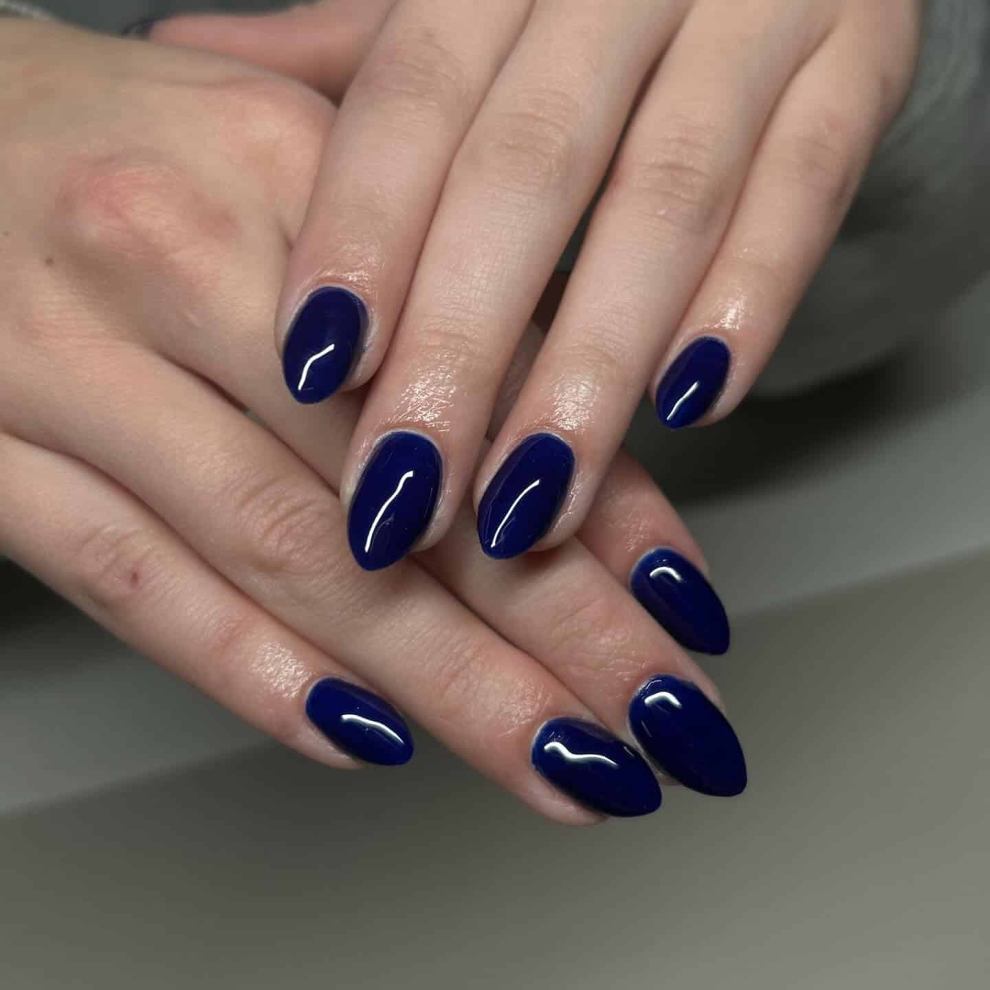 12. Electric Midnight Blue Almond Nails - dark blue nail ideas