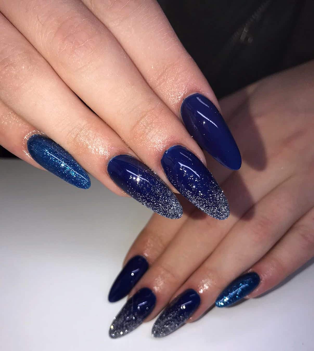 15. Navy and Silver Glitter Ombre Almond Nails - dark blue nail ideas
