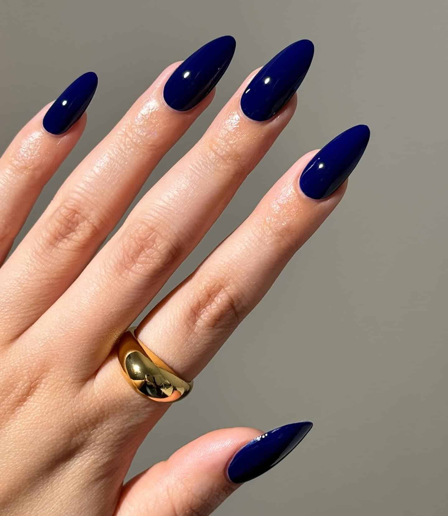 19. Deep Royal Blue Long Almond Nails - dark blue nail ideas