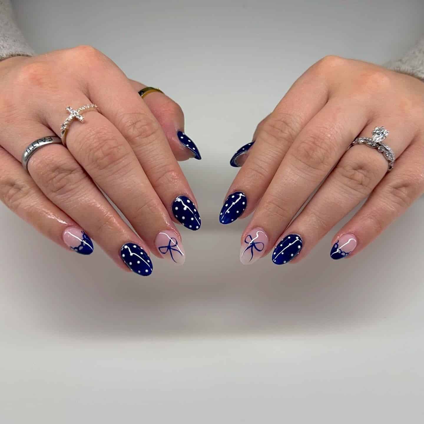 20. Navy Polka Dot and Bow Almond Nails - dark blue nail ideas