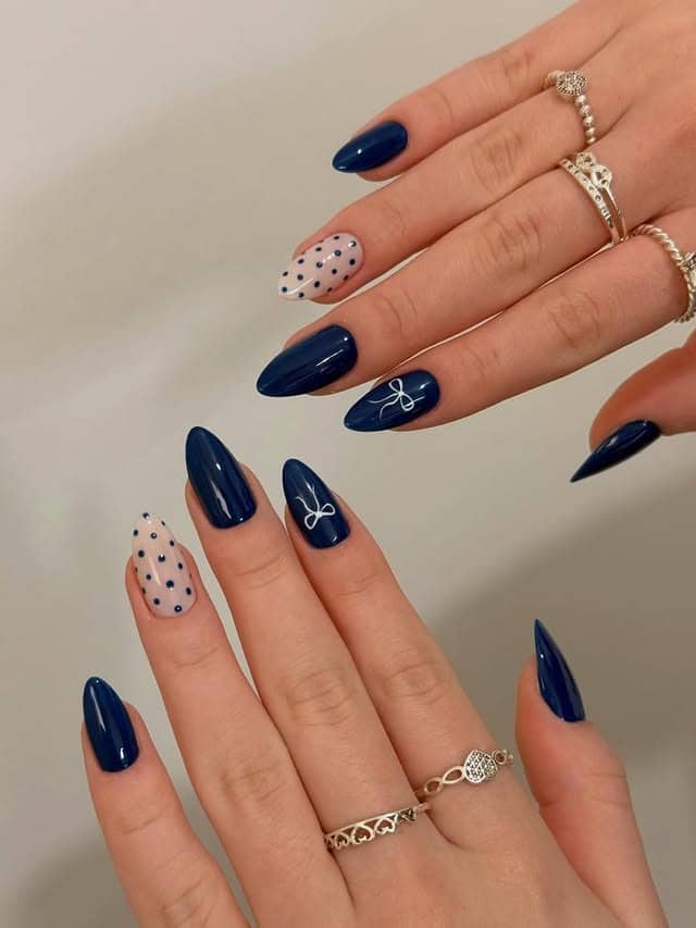 22. Navy Blue Polka Dot and Bow Almond Nails - dark blue nail ideas