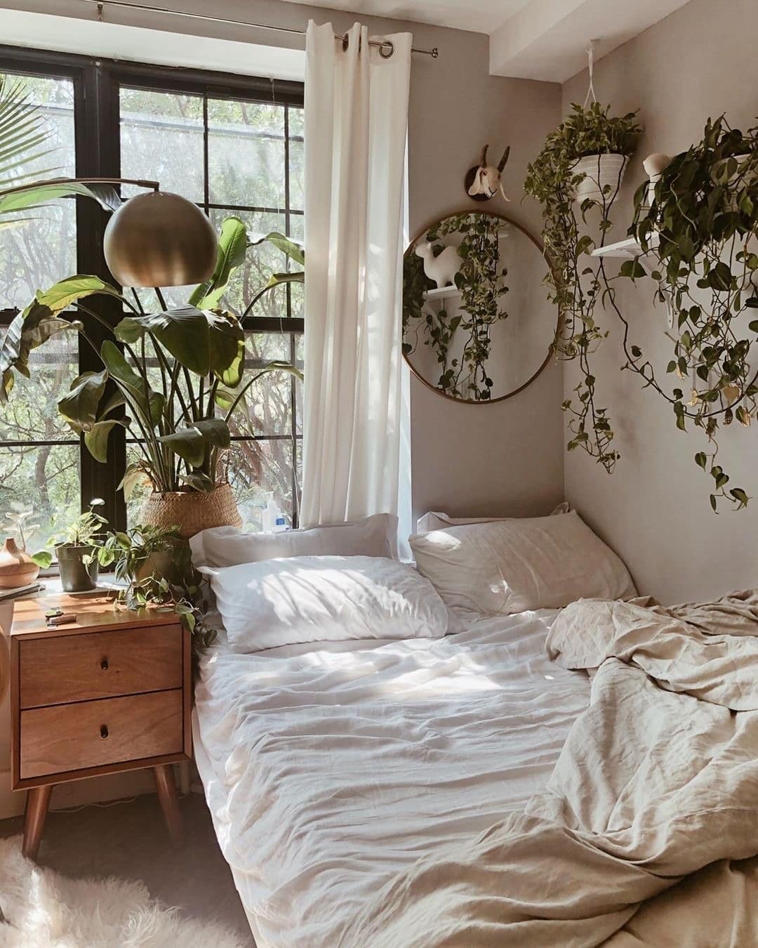 12. Warm Taupe and Green Tiny Bedroom with Hanging Plants - tiny home bedroom ideas