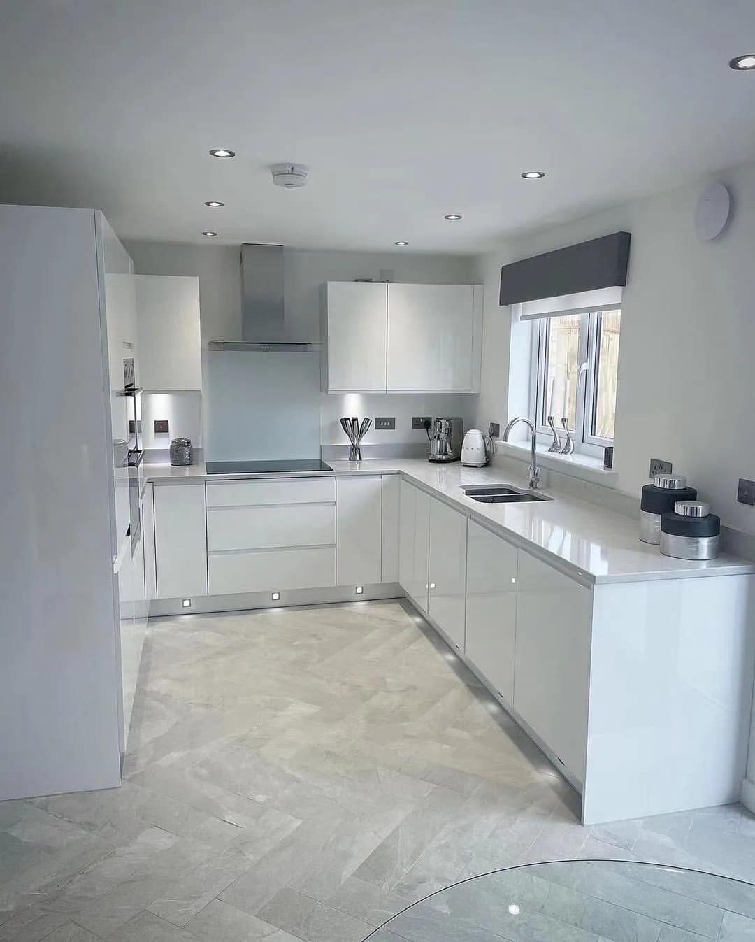 4. Glossy White Cabinets with Cool Gray Accents - white cabinets kitchen ideas