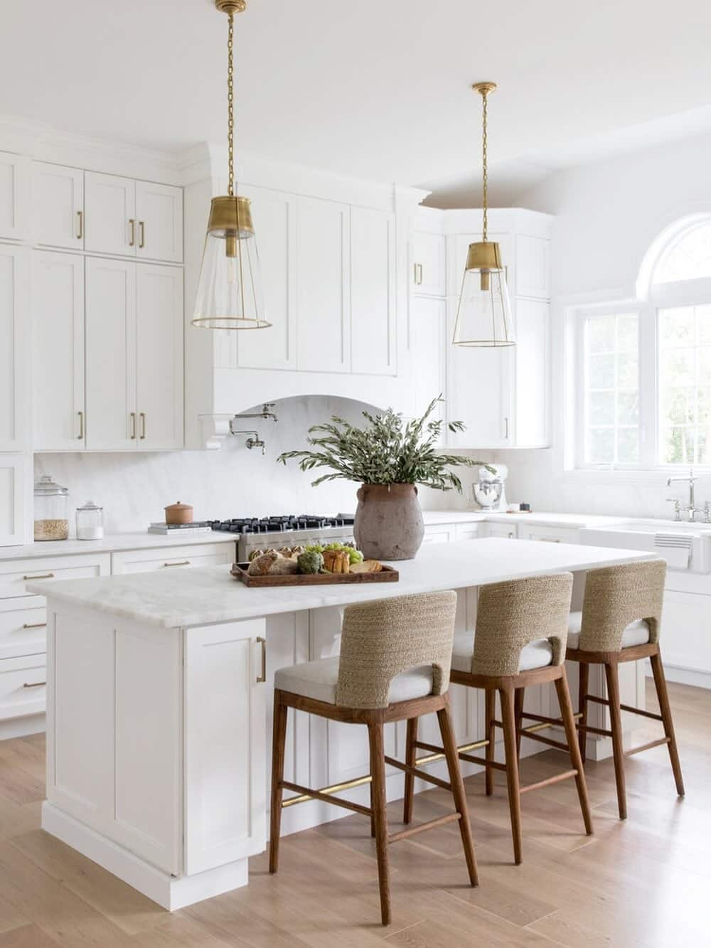 8. Ivory White Cabinets with Natural Woven Seating - white cabinets kitchen ideas