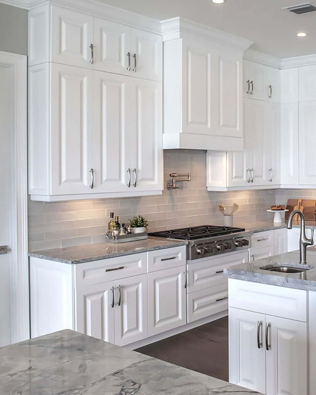 9. Bright White Cabinets with Soft Gray Stone - white cabinets kitchen ideas