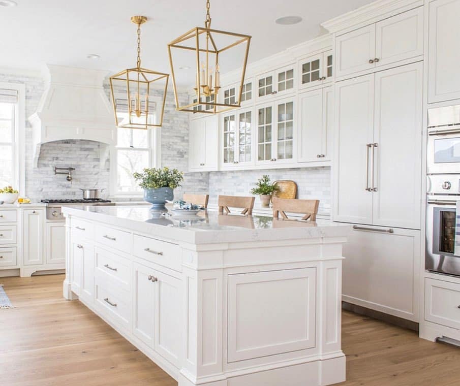 10. Classic White Cabinets with Gold Lantern Lighting - white cabinets kitchen ideas