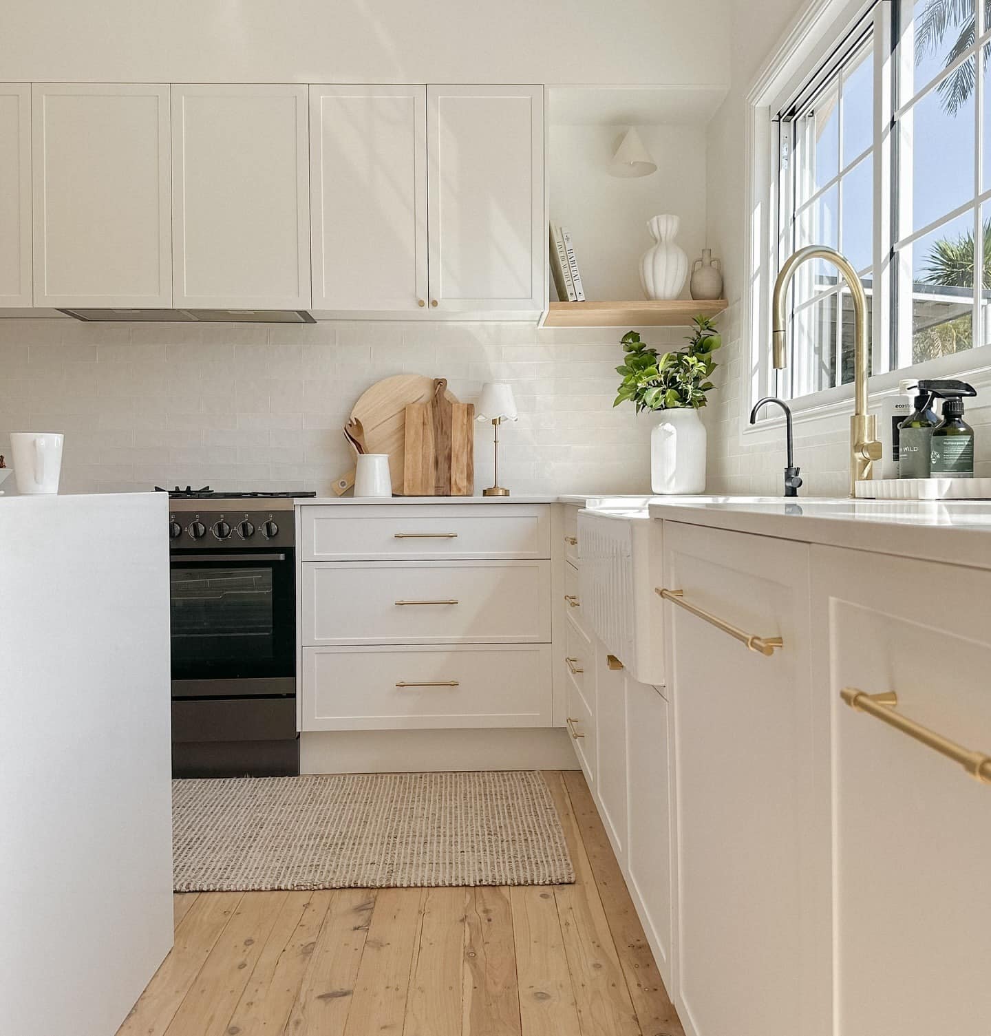 12. Creamy White Cabinets with Pale Oak and Brushed Gold - white cabinets kitchen ideas