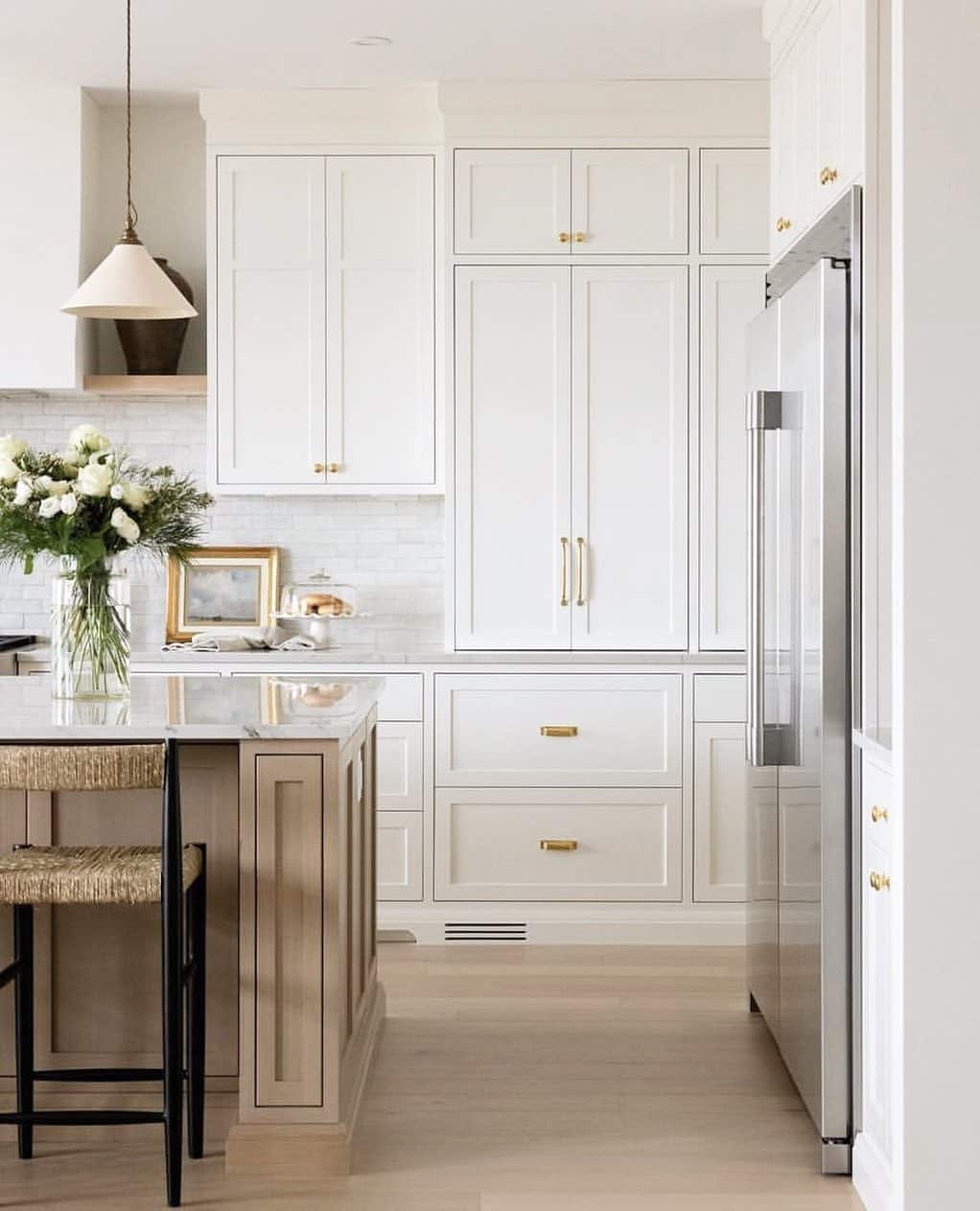18. Soft White Cabinets with Champagne Gold and Taupe Island - white cabinets kitchen ideas
