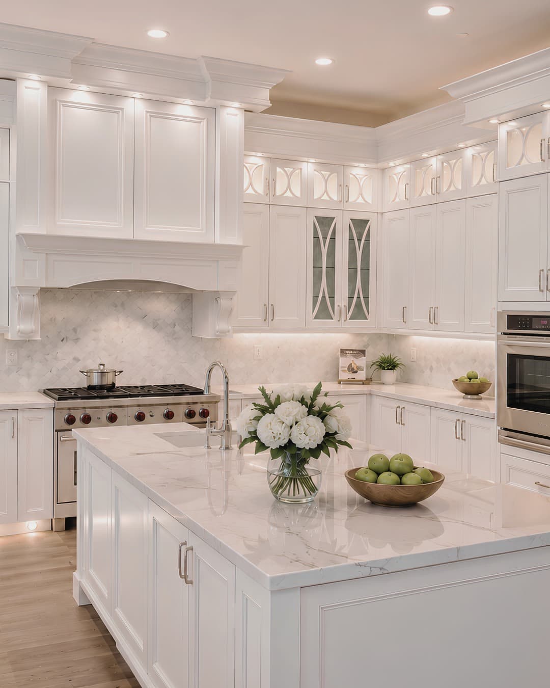 20. Ornate White Cabinets with Pearl Marble and Silver Accents - white cabinets kitchen ideas