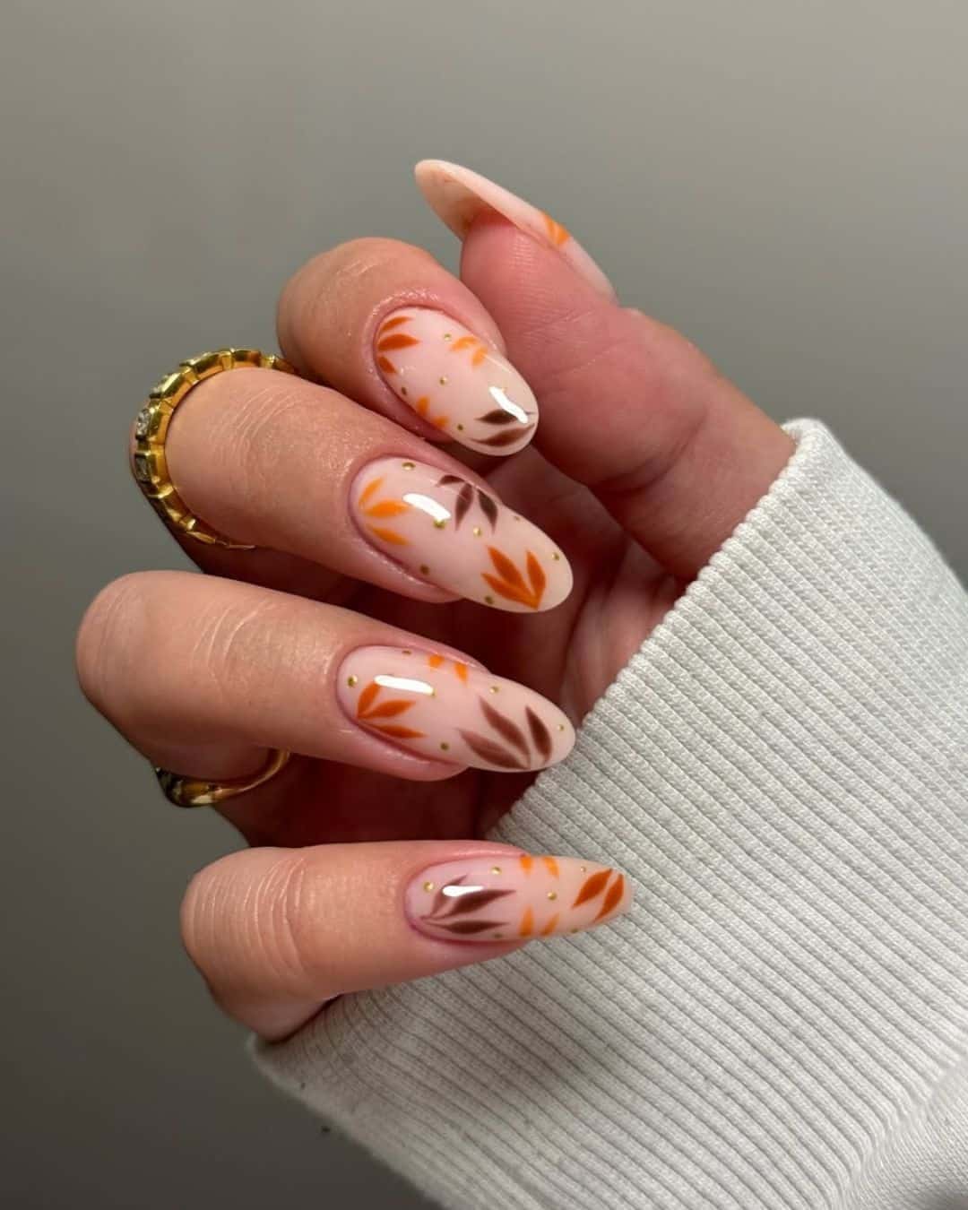1. Burnt Orange and Brown Leaf Almond Nails - fall leaf nail ideas