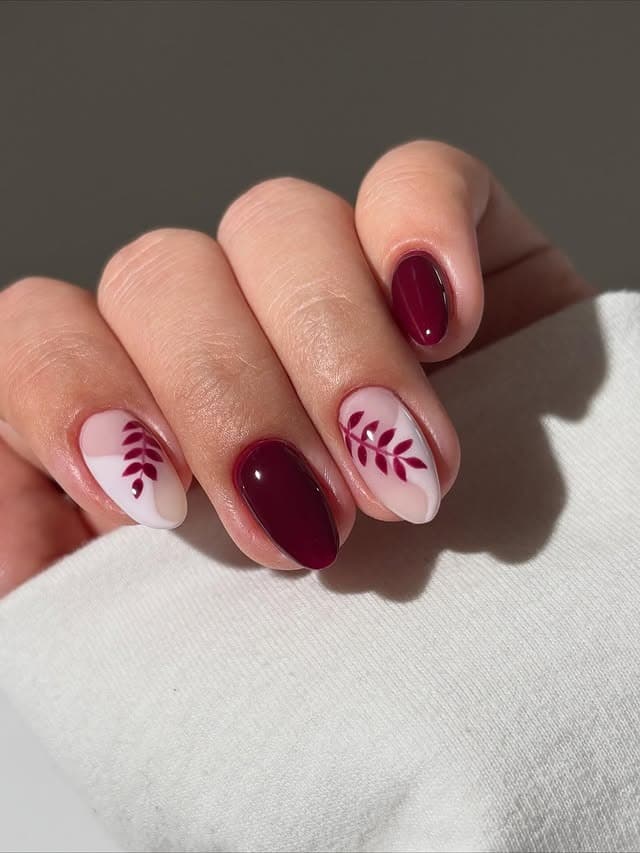 4. Burgundy Leaf Short Oval Nails - fall leaf nail ideas
