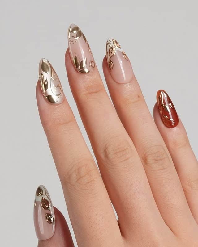 7. Gold Chrome Leaf Almond Nails - fall leaf nail ideas