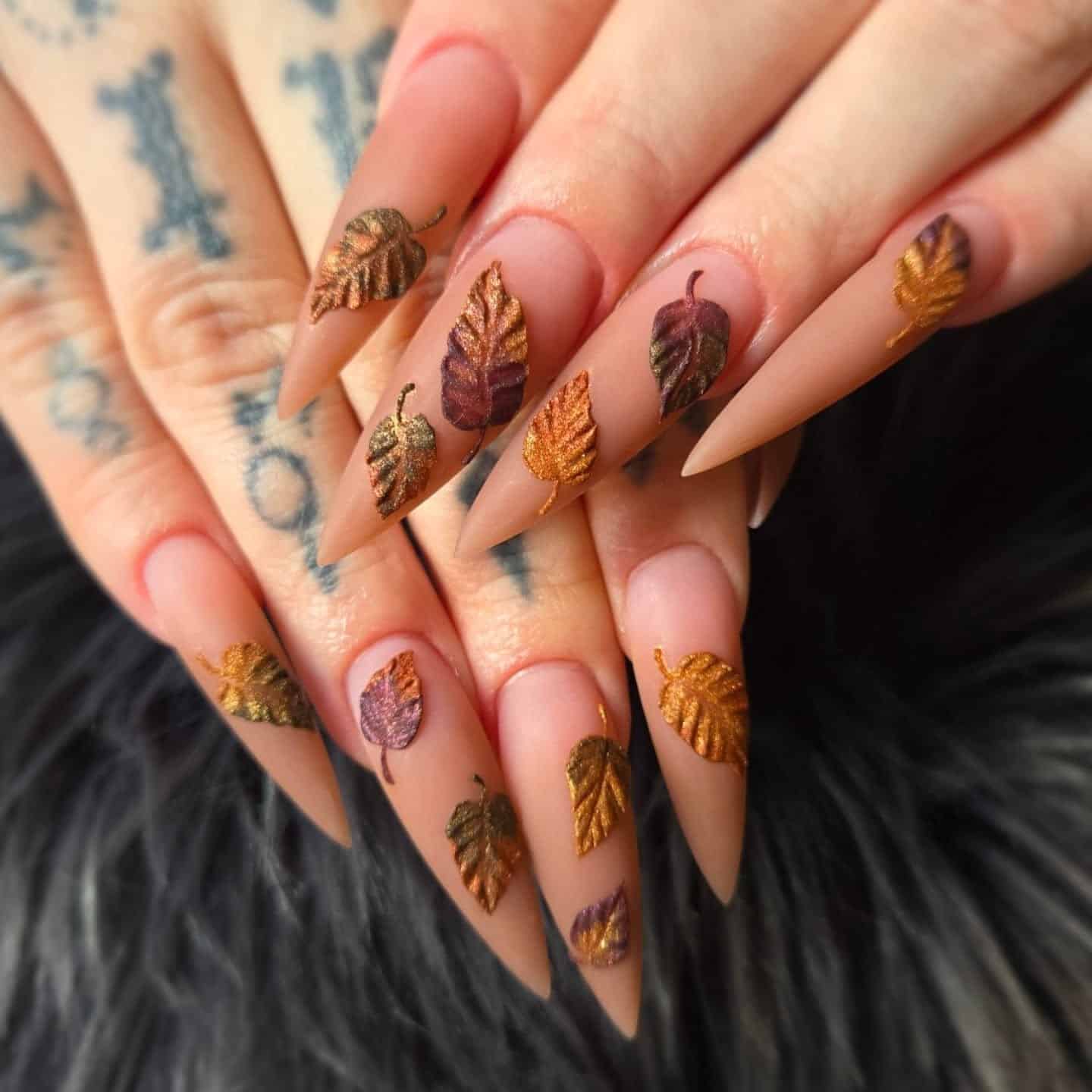 9. Metallic Autumn Leaf Stiletto Nails - fall leaf nail ideas