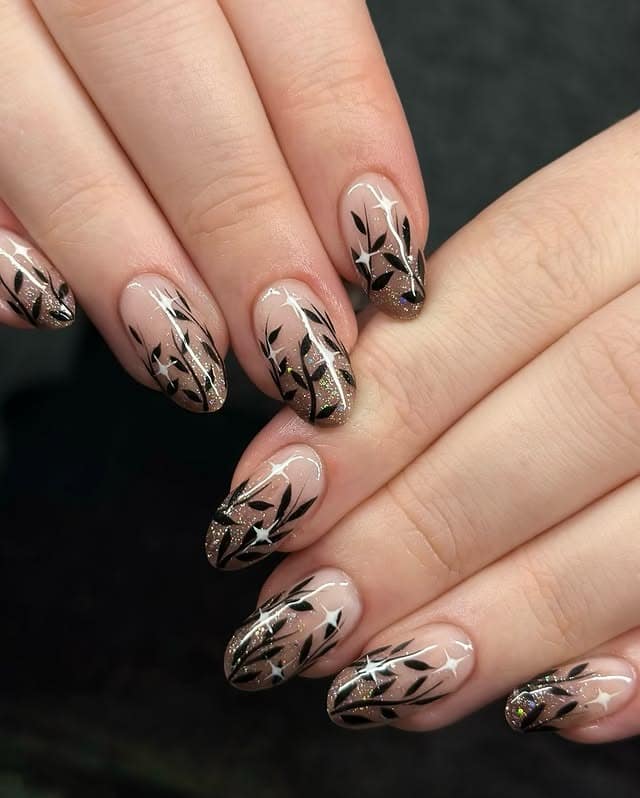 14. Black and Bronze Glitter Leaf Almond Nails - fall leaf nail ideas