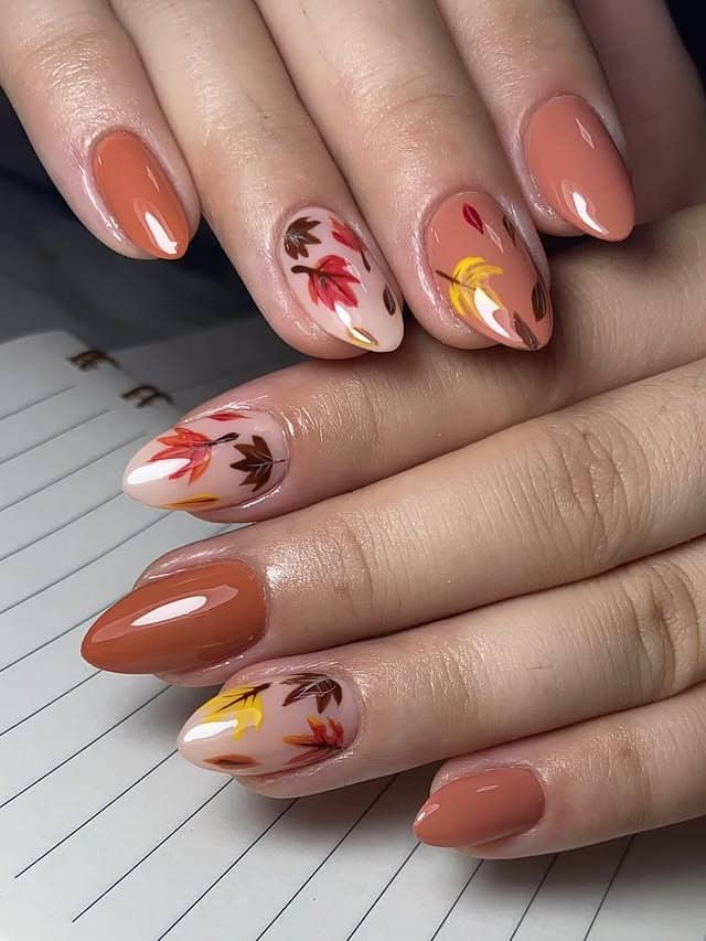 15. Caramel Nude Autumn Leaf Almond Nails - fall leaf nail ideas
