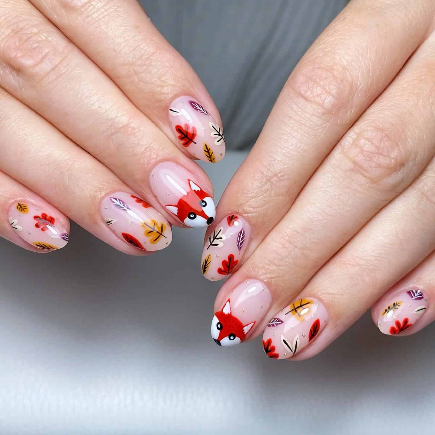 16. Fox and Fall Leaf Nude Oval Nails - fall leaf nail ideas
