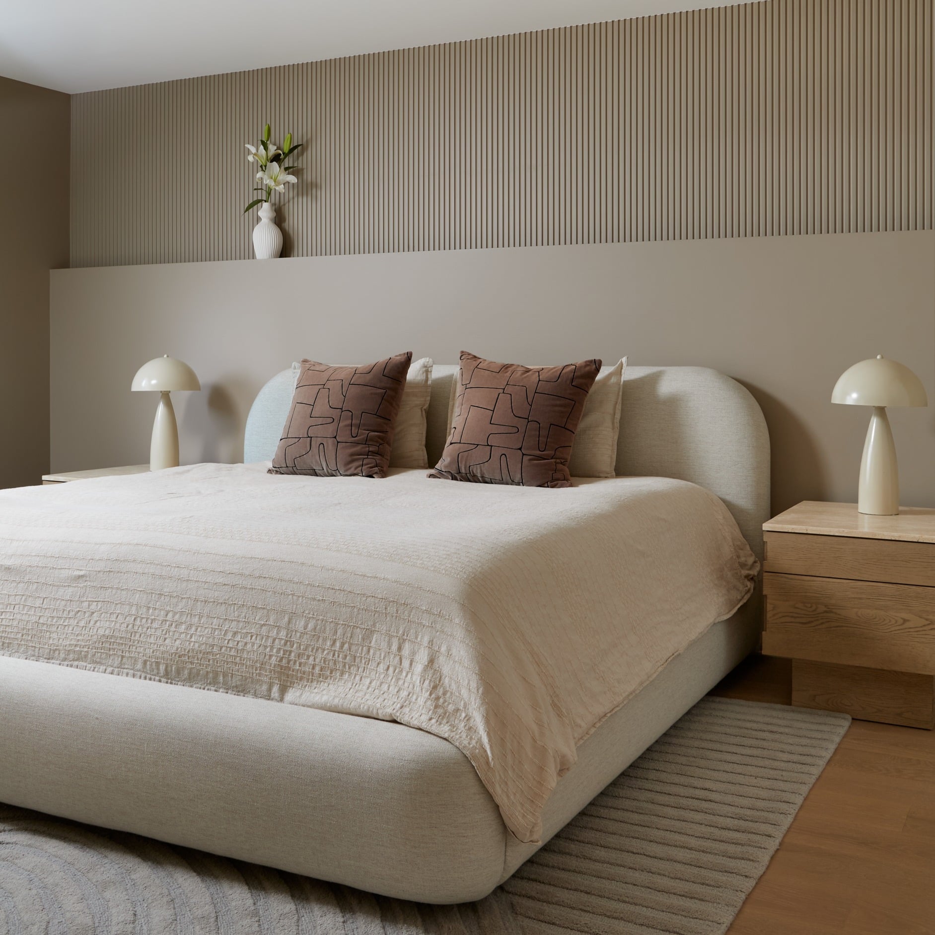 2. Taupe and Cream Bedroom with Fluted Wall Paneling - elegant bedroom ideas