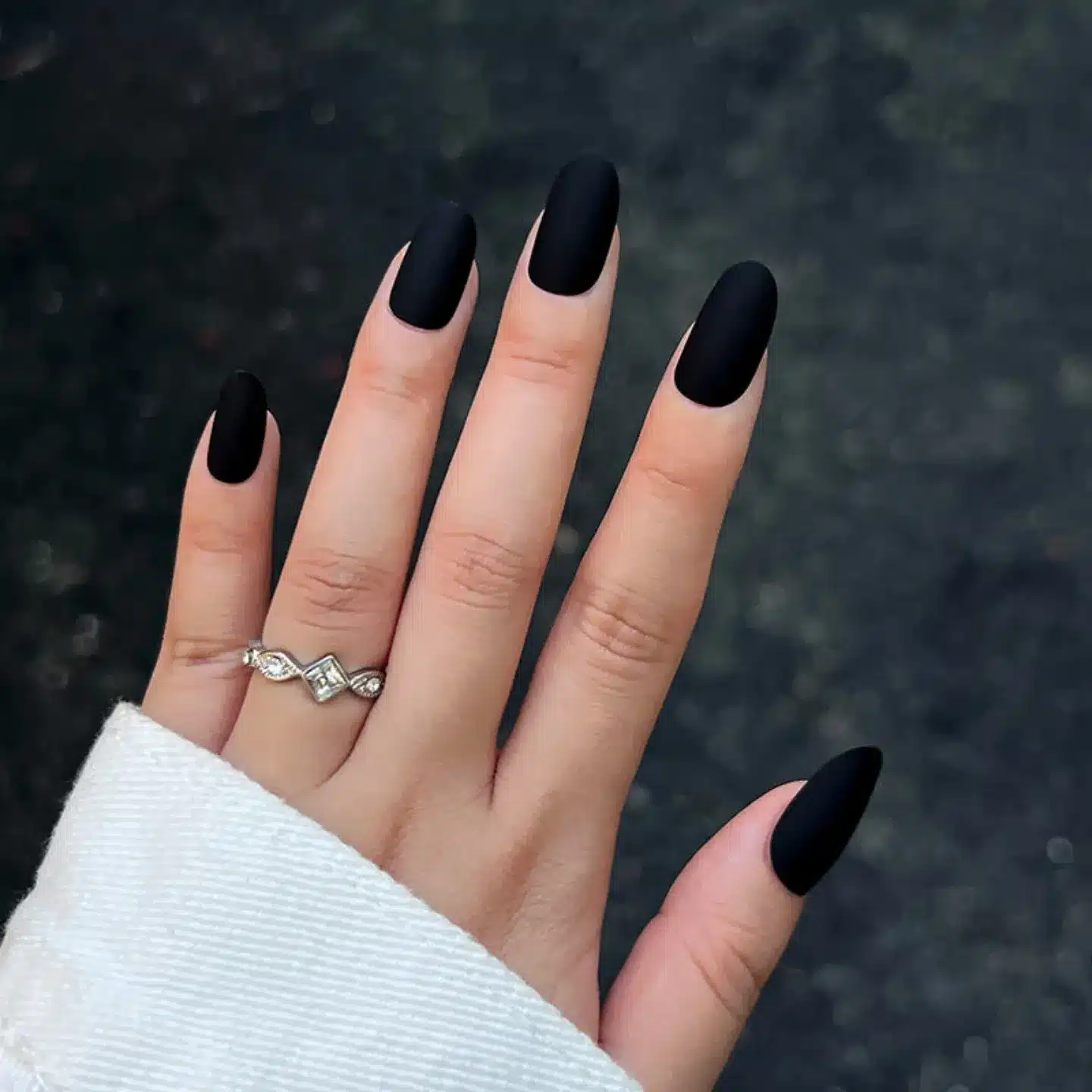 2. Classic Matte Black Almond Nails - matte black nail ideas