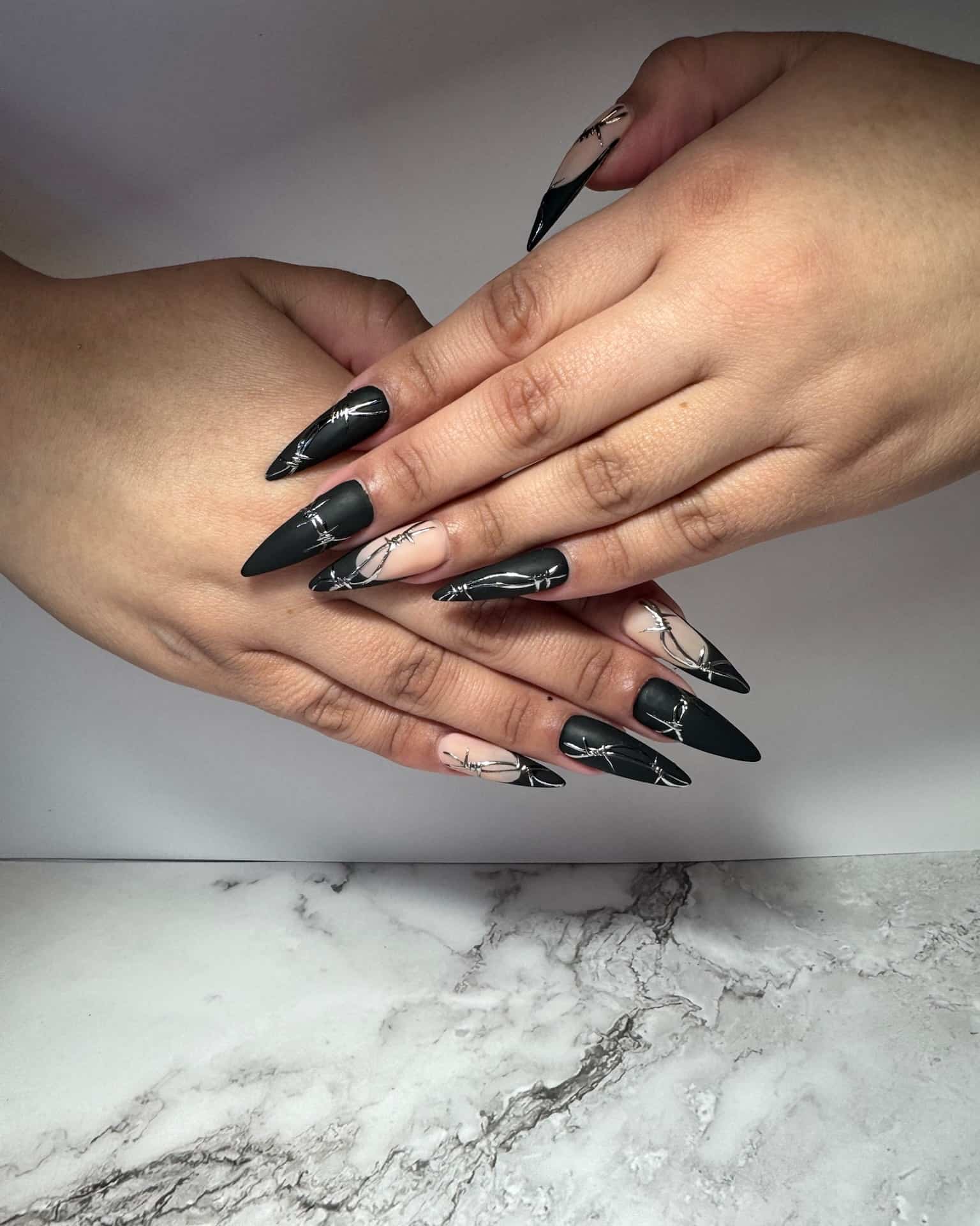 5. Matte Black and Nude Barbed Wire Stiletto Nails - matte black nail ideas