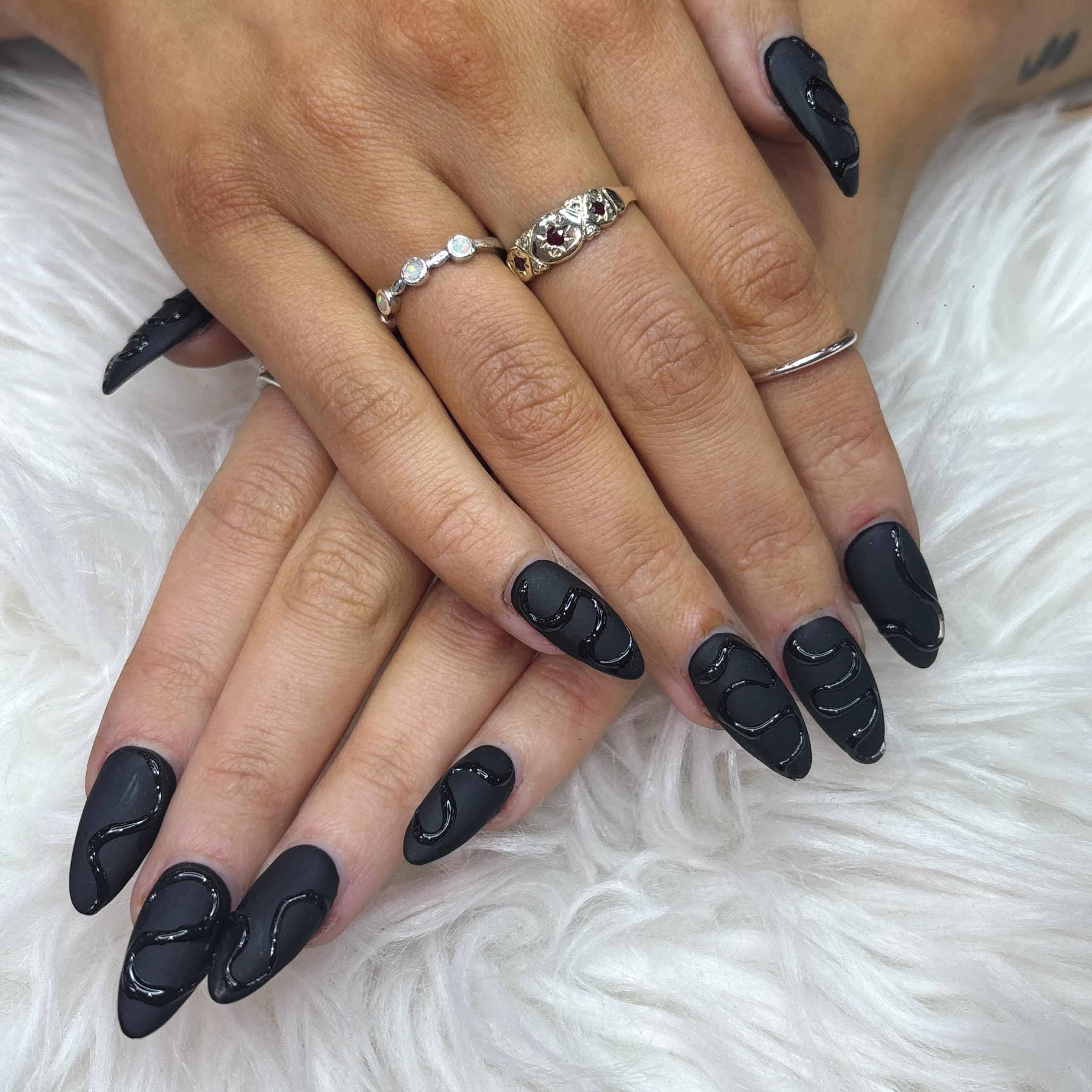 10. Matte Black Almond Nails with Abstract Glossy Lines - matte black nail ideas