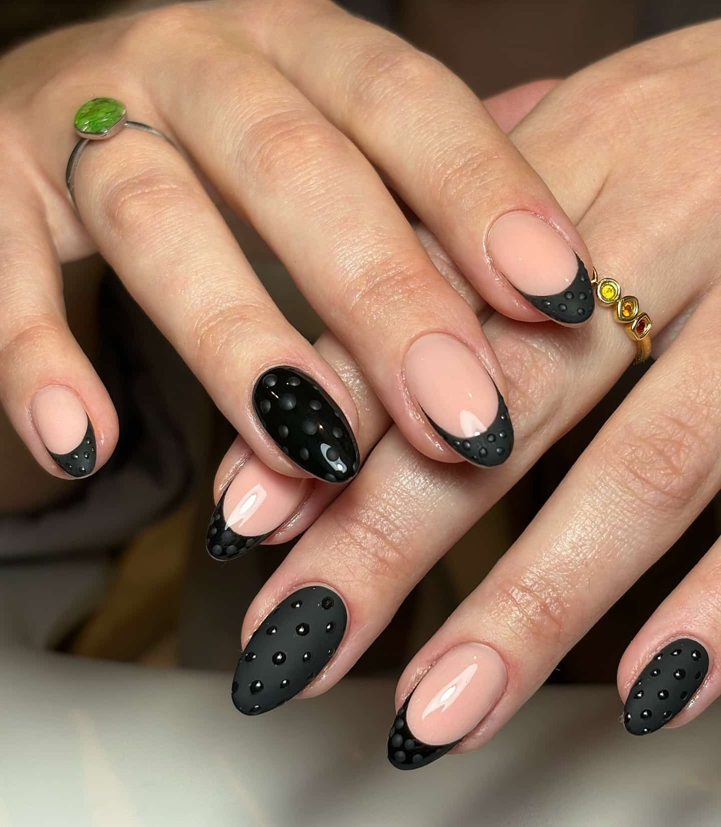 13. Nude and Matte Black Dotted French Almond Nails - matte black nail ideas