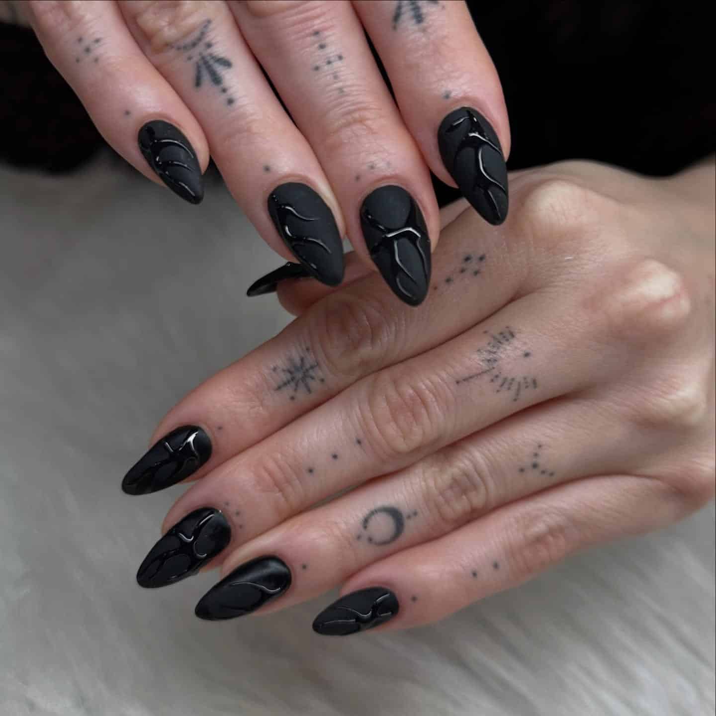 19. Matte Black Almond Nails with Glossy Sculpted Lines - matte black nail ideas