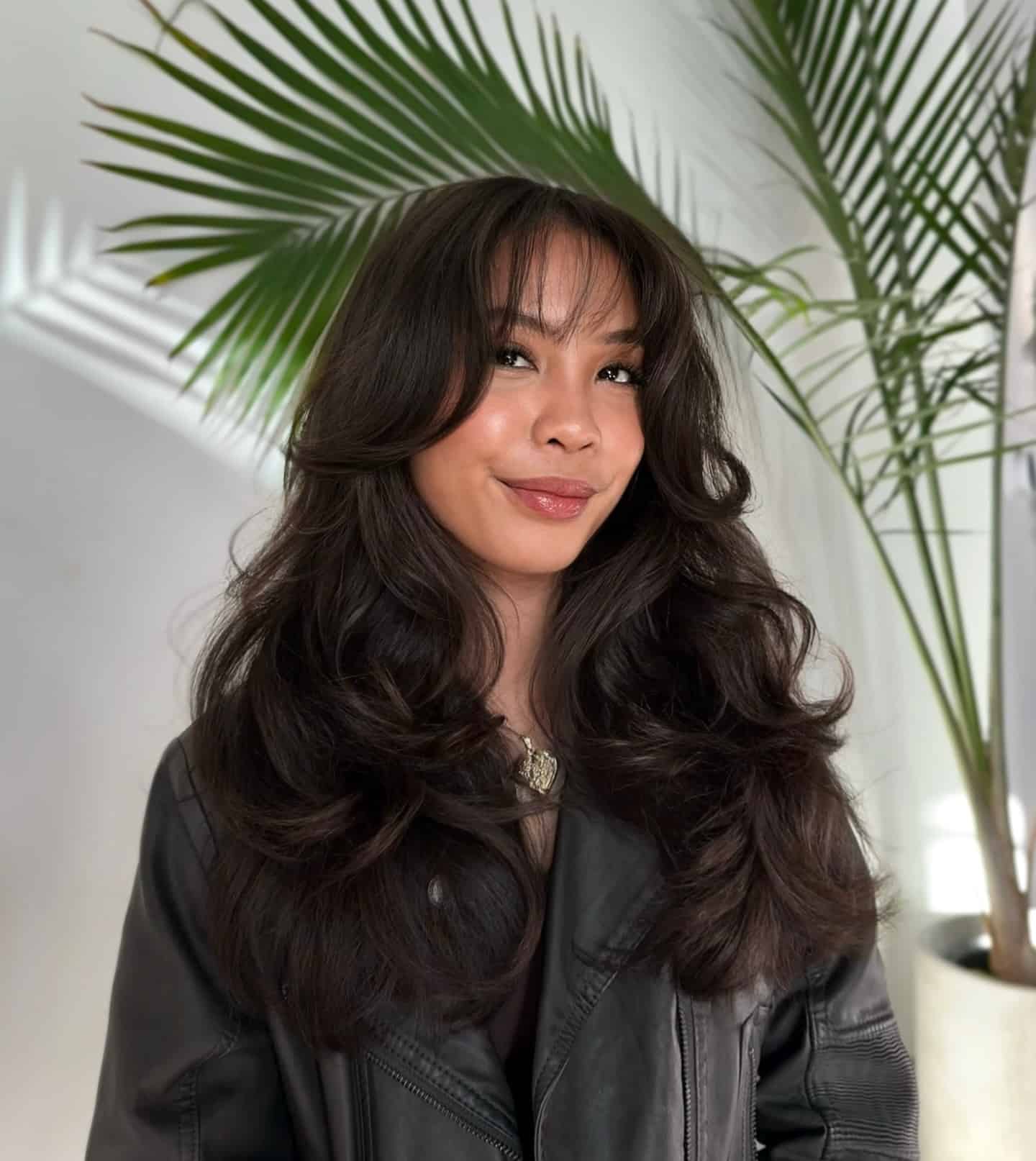 4. Deep Brunette Butterfly Cut with Bottleneck Fringe - Fringe Hairstyles