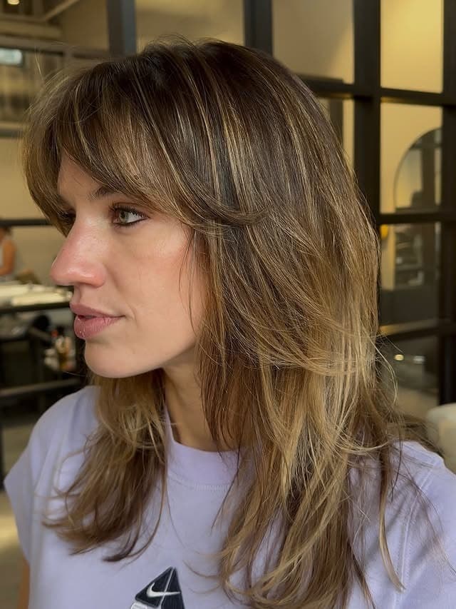 8. Bronde Layered Cut with Curtain Fringe - Fringe Hairstyles