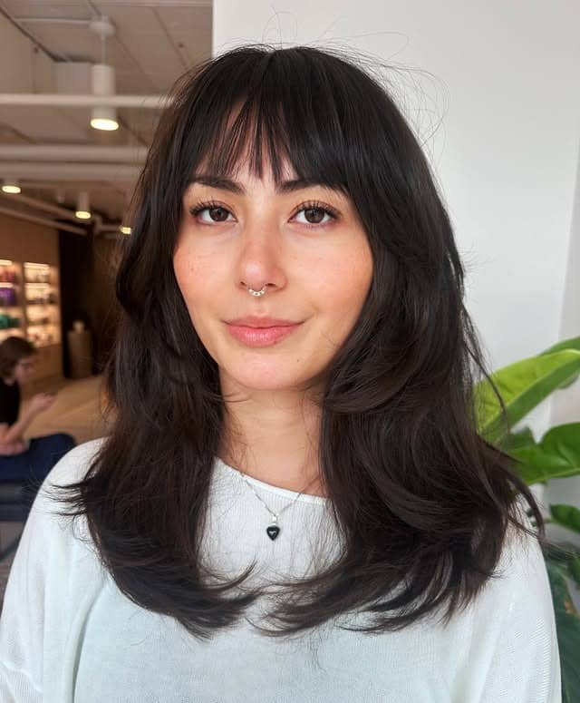 10. Soft Black Layers with Wispy Fringe - Fringe Hairstyles