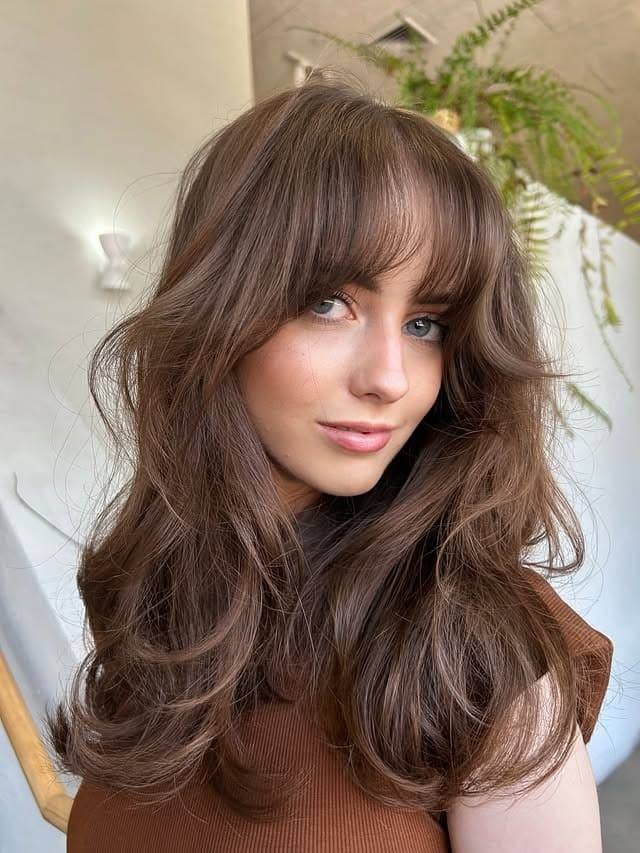 12. Cocoa Brown Voluminous Layers with Curtain Fringe - Fringe Hairstyles