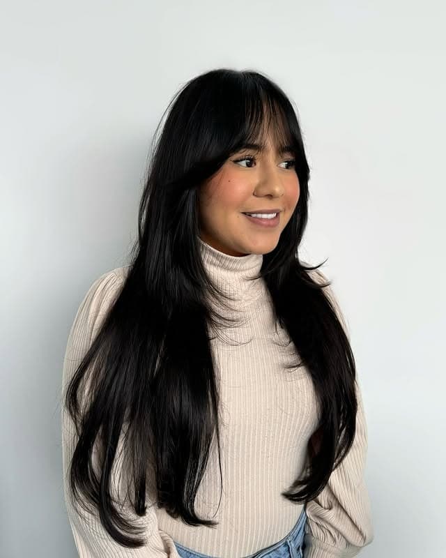 19. Jet Black Long Layers with Curtain Fringe - Fringe Hairstyles