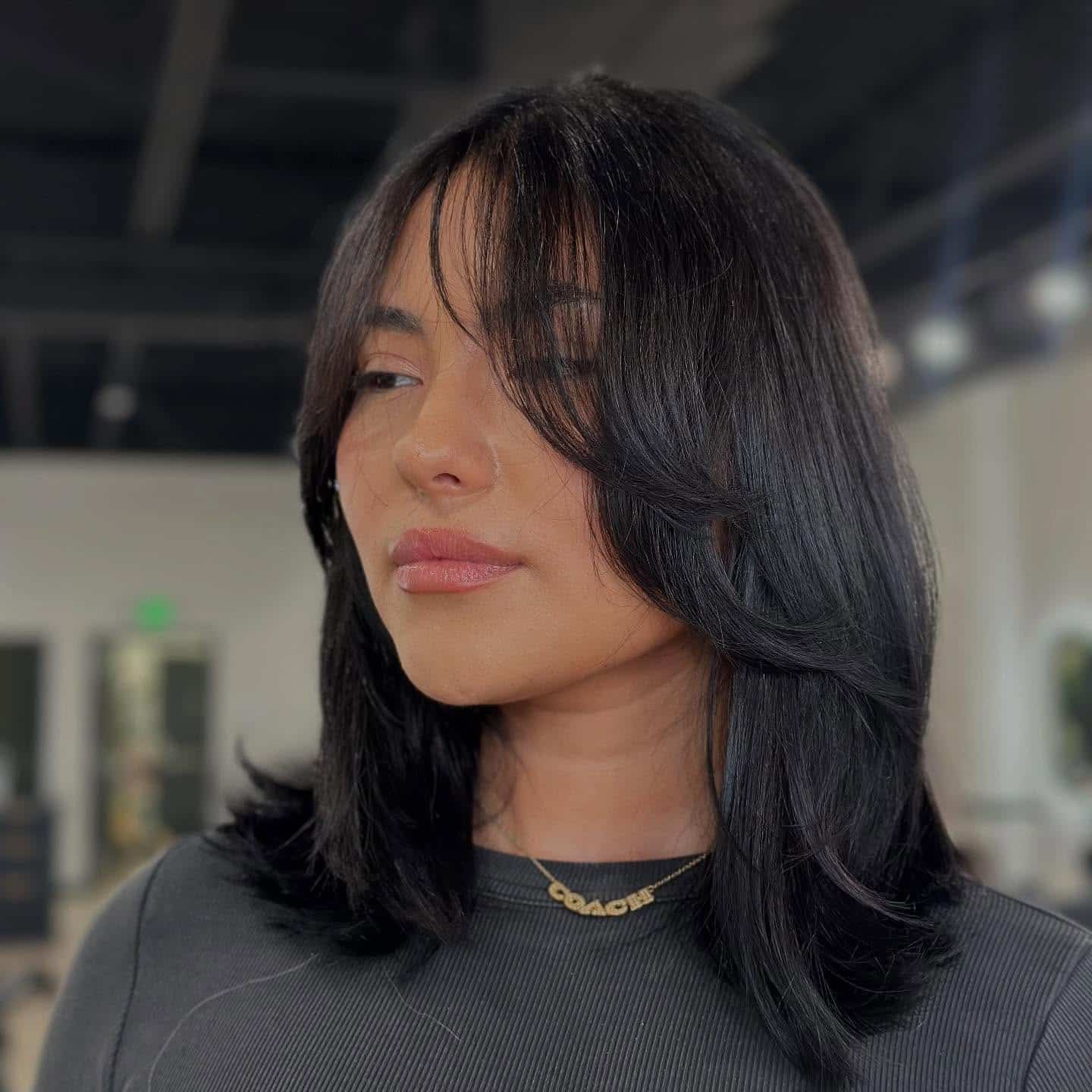 22. Soft Black Midi Layers with Curtain Fringe - Fringe Hairstyles