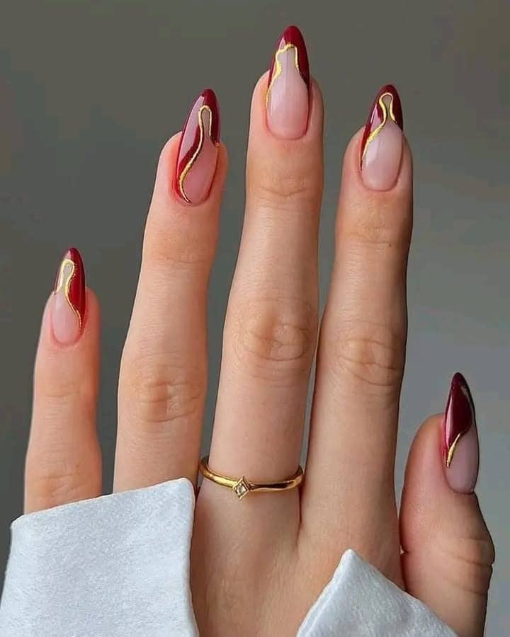 8. Burgundy and Gold Swirl Almond Nails - nail ideas for long nails