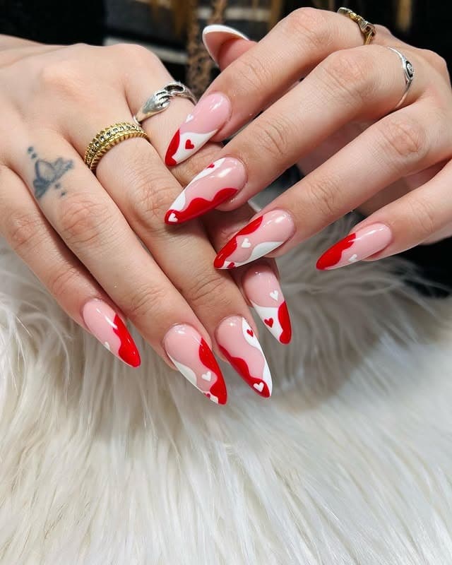 9. Red and White Heart Wave Almond Nails - red and white nail ideas