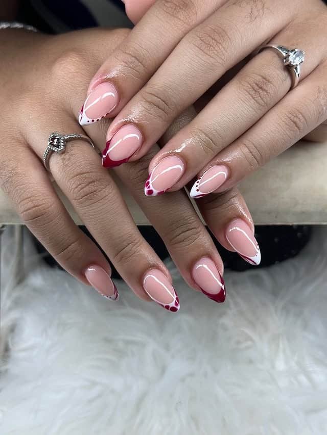13. Burgundy and White Curved French Almond Nails - red and white nail ideas